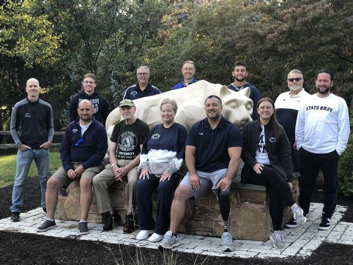 2023 Mont Alto Alumni Society Board of Directors stand around the Nittany Lion Shrine